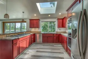 Another angle of the kitchen showing how it is filled with windows.