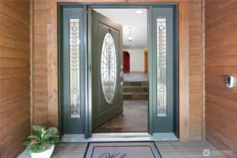 Entry with lighted coat closet.