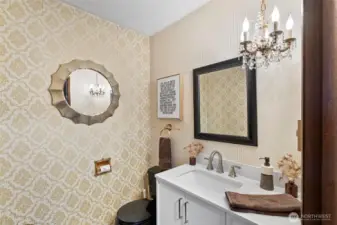 Half bath off of potential primary bedroom or den.