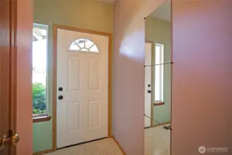 entry way with coat closet and entry to garage