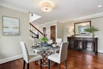 The dining room works well with a round table, but a rectangle or square works equally well.