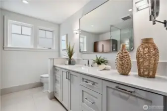 The primary bath is very pretty and neutral. Double sinks and great storage.