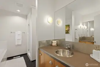 Dual vanities and separate spaces for sinks/bathing utilize every inch of space.