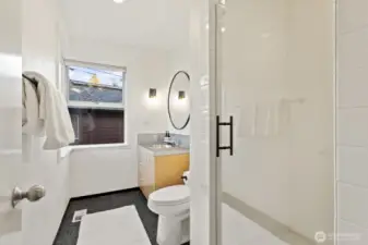 Stylishly appointed 3/4 bathroom upstairs.
