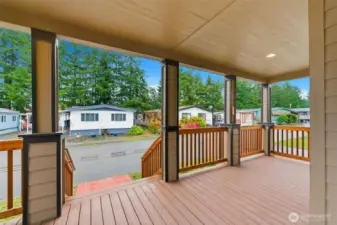 Enjoy morning coffee or evening chats on the expansive covered front porch with room to unwind year-round.