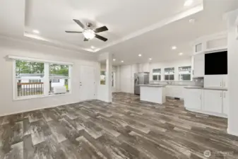 Enjoy the open, airy feel of the living room with wide windows that bring in natural light and a peaceful view.