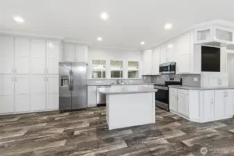 Beautifully designed kitchen showcases stainless steel appliances, abundant cabinetry/storage, and modern finishes.