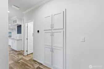 Wide hallway with added storage makes for easy movement and smart organization throughout the home.