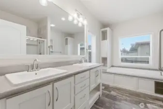 Bright and spacious primary bath offers plenty of counter space and room to move comfortably.