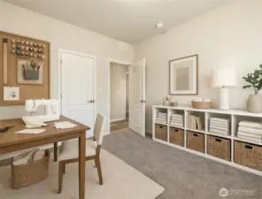 Versatile third bedroom can easily serve as a hobby room, craft space, or comfortable flex area. (Photo virtually staged)