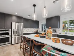 Beautifully designed community kitchen with modern finishes—perfect for potlucks, gatherings, and special events.