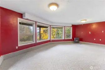 Lower level game/family room has a gas stove and lots of natural light