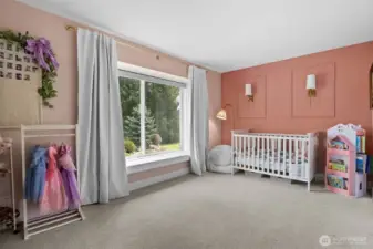 Bedroom 1 upstairs features a picture frame moulding wall accent and sconces.