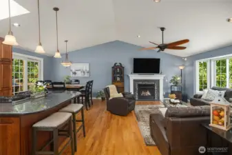 Vaulted ceiling, beautiful ceiling fan. Gorgeous hardwood oak floors. Natural light comes in from both sides.