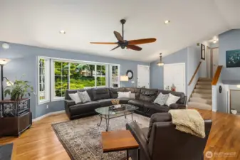Spacious living room with expansive bay window.