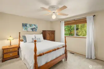 Primary bedroom with 2 generously sized closets and en-suite bath.