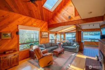 Main house living area, looking toward dining area and the bay