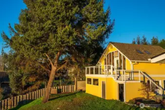 West/water side of garage/loft studio, with garden storage area underneath