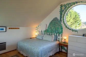 Loft studio sleeping area with charming port window (eastern exposure)