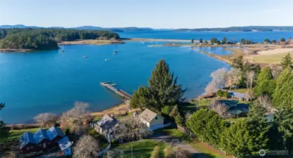 Aerial overlooking property to the northwest, the entrance to Fisherman Bay, Upright Channel, and Shaw Island. The Spit Preserve (Lopez Island) in upper left/middle