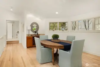 The dining room on the main level enjoyng windows on both sides.