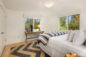 2nd bedroom has western and northwestern facing windows with winter whisper views of lake