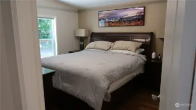 Main bedroom looks outside at the trees and listen to the creek while you fall asleep.