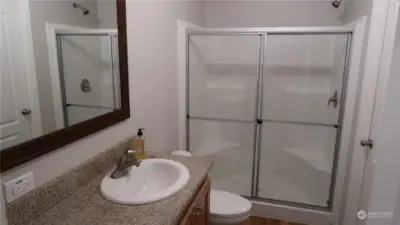 Bathroom with large shower and sit area for you.