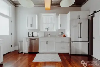 Bright, country kitchen with tin ceiling