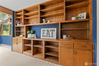 Custom shelves in the solarium just add to the elegance