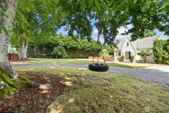 Private, picturesque yard with tire swing