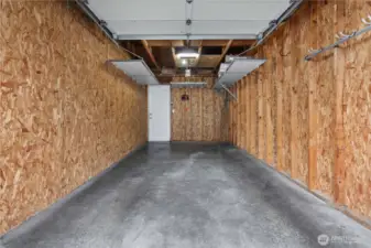 Talk about your immaculate garage with custom overhead storage.  Room for your vehicle and more.  Very secure!  Just down a walk way from your townhome