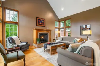 The vaulted ceilings amplify the home’s spacious, open-concept design, while transom windows fill the space with natural light.