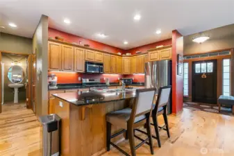 The spacious island offers ample seating—perfect for entertaining guests or enjoying a quiet morning coffee.