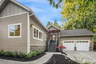 Paved path wraps around entire home.