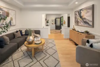 Main floor living room looking at front door.