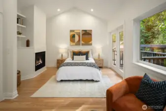 Main floor primary suite with private balcony.