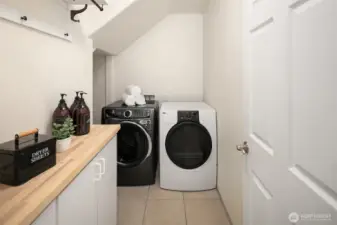 Laundry located downstairs off hallway.