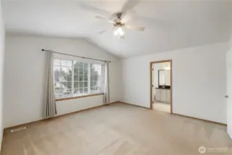Primary Bedroom with vaulted ceilings.