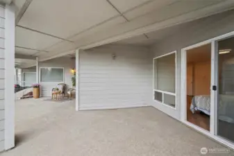 Large covered deck off primary bedroom