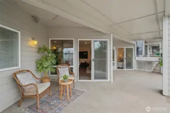 Spacious south-facing covered deck off of living area and primary bedroom