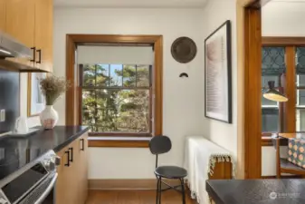 Light filled kitchen with picturesque window looking out to the private backyard.