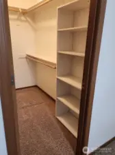 Spacious primary walk-in closet.