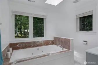 Upstairs bathroom with whirlpool bath.