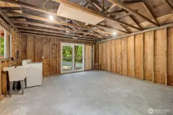 The shop offers a wonderful opportunity for so much. Workshop, game room for pool or shuffleboard or ping pong, as well as laundry and utility space. It could also be a bunkhouse for additional guests.
