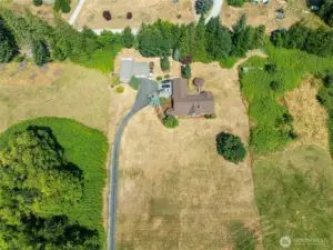 Great view of the main home and ADU. Paved driveway has a gate at the entrance. Shared with a home to the south.