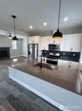 Huge peninsula! Countertops are a buyer selection. *Previous Build
