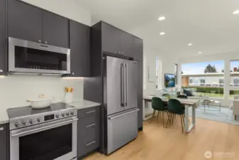 Smartly crafted cabinetry, premium appliances, and abundant counter space make this kitchen a joy to cook in while keeping modern design front and center.