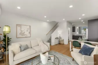 The inviting living area embraces natural light and neutral tones, creating a backdrop for your own personal style.