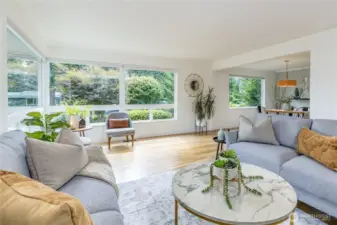 Multiple large windows flood the space with natural light